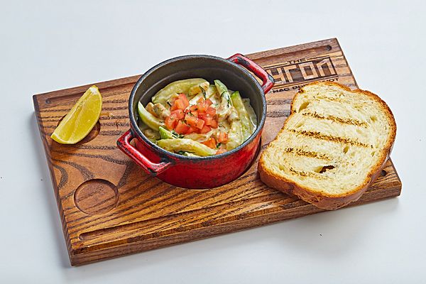 Мясо рапаны из угольной печи