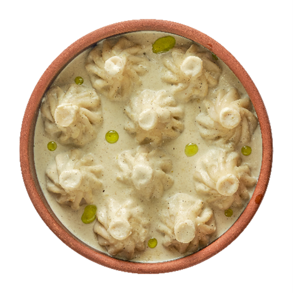 Мини-хинкали с курицей в соусе чкмерули